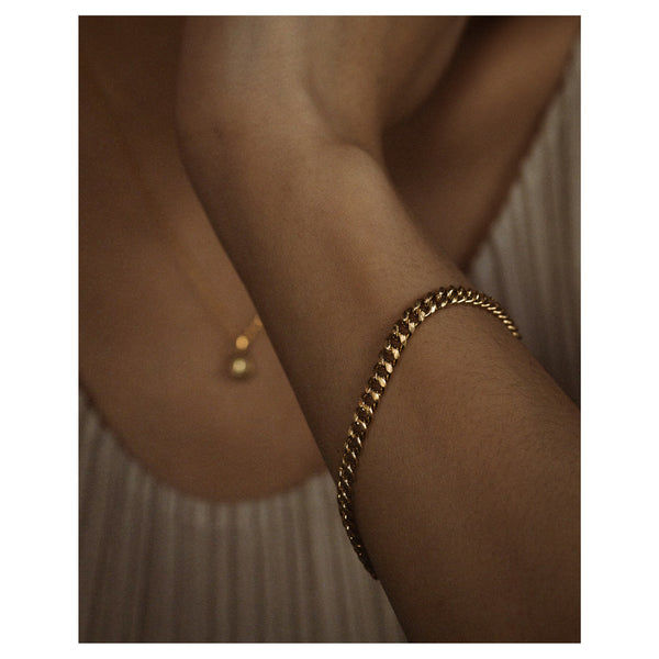X Gold Curb Link Chain Bracelet